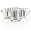 Platinum ring featuring three stunning emerald cut diamonds each set in a classic four claw setting.