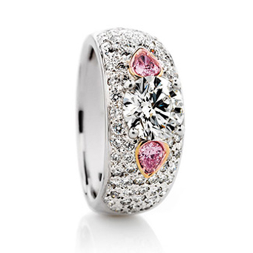 Brilliant pear cut pink diamonds in a pave ring
