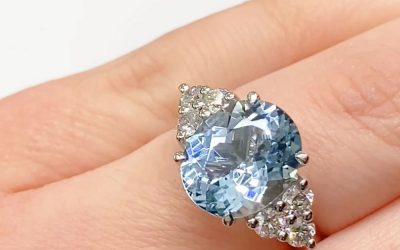 Oval cut aquamarine with 6 round diamonds ring