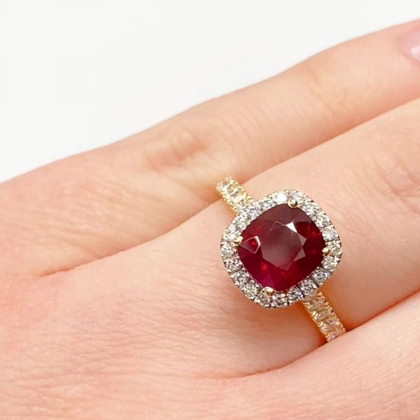 Cushion cut Ruby with halo and diamond band