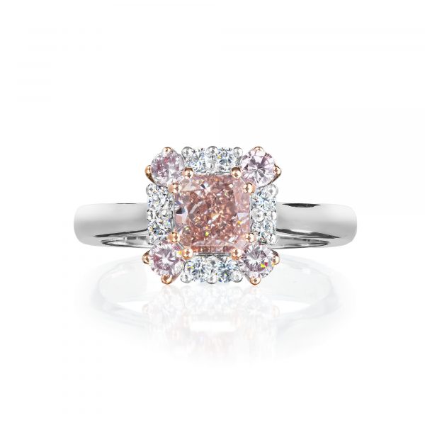 pink diamond ring in 18 karat gold set in a cluster of pale pink and white diamonds. Stamped HD