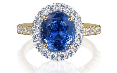 Oval cut sapphire with diamond halo ring