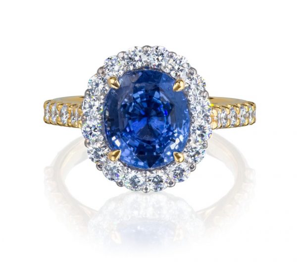 natural unheated sapphire and diamond cluster ring in platinum and 18 karat yellow gold, with diamond set shoulders