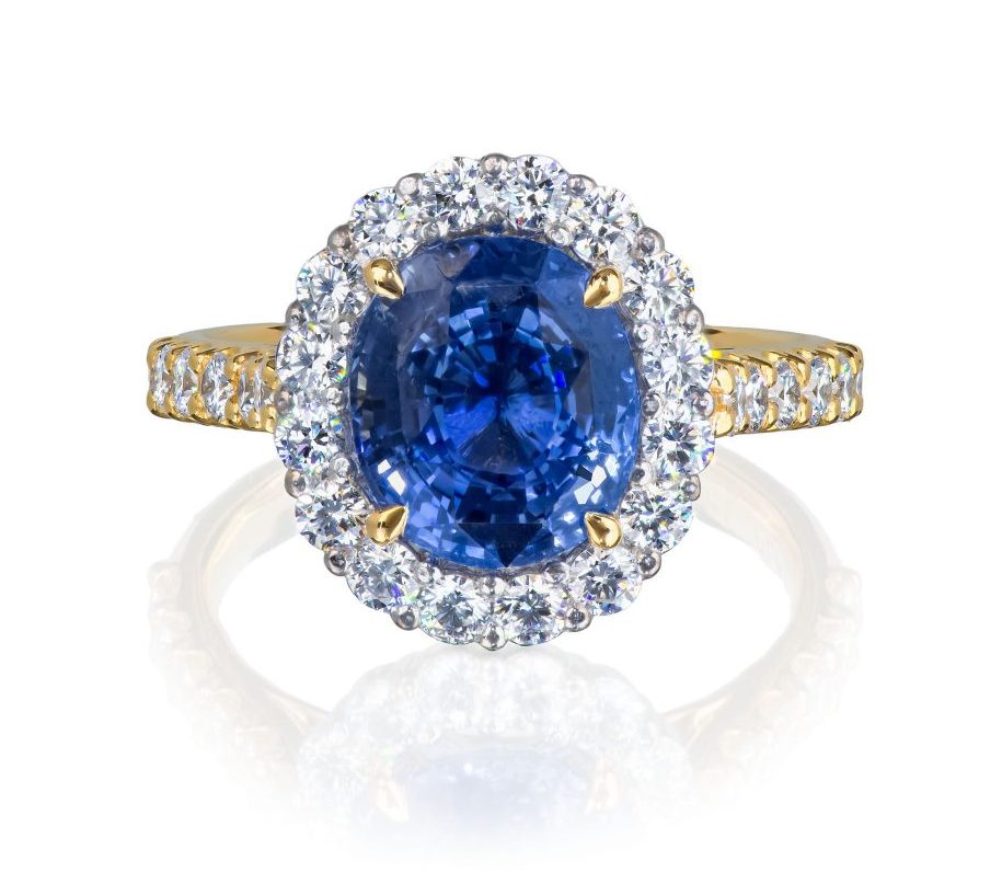 080643 Front natural unheated sapphire and diamond cluster ring in platinum and 18 karat yellow gold, with diamond set shoulders