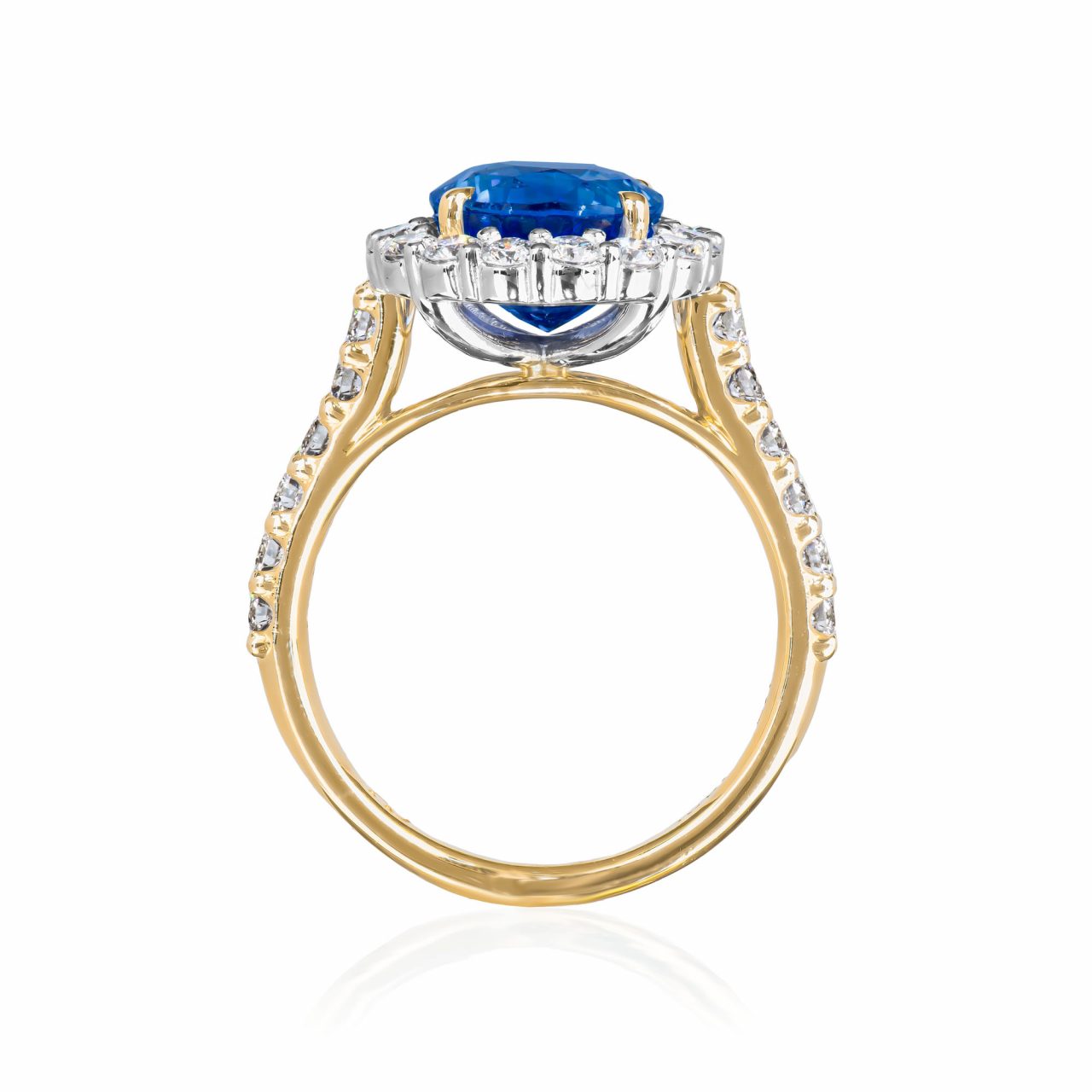 natural unheated sapphire and diamond cluster ring in platinum and 18 karat yellow gold, with diamond set shoulders standing