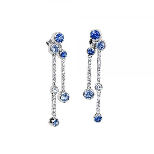 sapphire and diamond drop earrings in 18 karat white gold, comprising five round blue sapphire