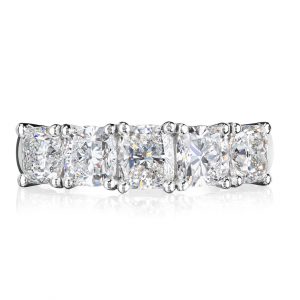 18 karat white gold and platinum claw set five across graduating cushion cut diamond ring.