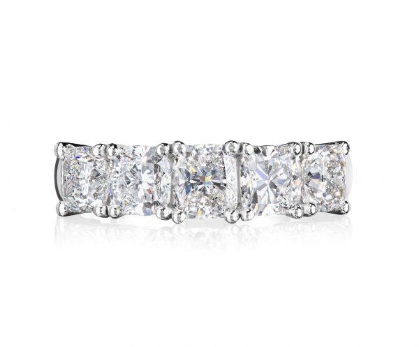 18 karat white gold and platinum claw set five across graduating cushion cut diamond ring.