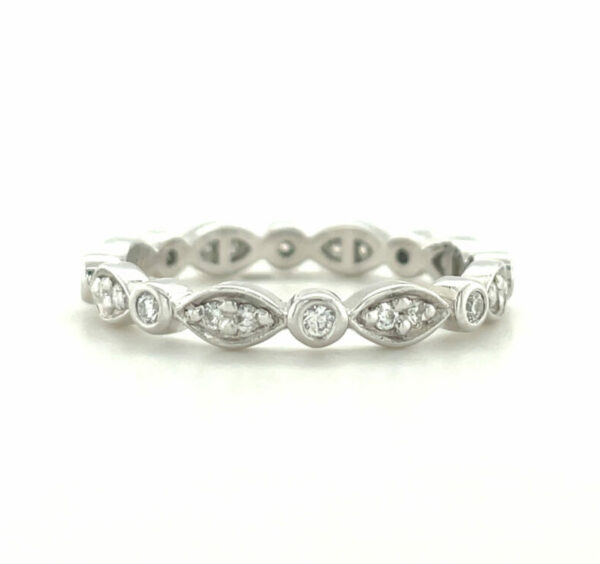 Platinum round brilliant cut diamond ring set into marquise and round shaped bezel settings