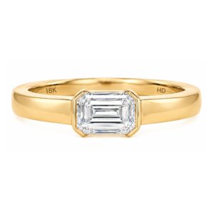 East West Half Bezel Emerald Cut Ring