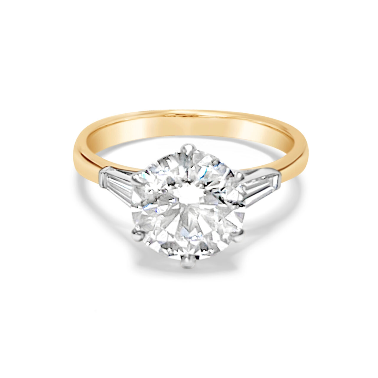 Round Brilliant Cut Ring with Tapered Baguette Diamonds