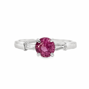 A pink sapphire and diamond ring